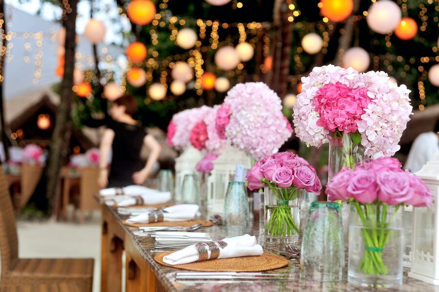 Beautifully catered event with round banquet tables and warm lighting