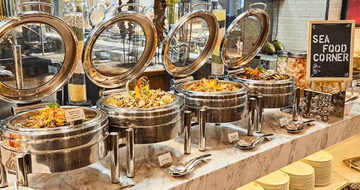 Halal buffet spread of assorted Malay, Chinese and Indian dishes