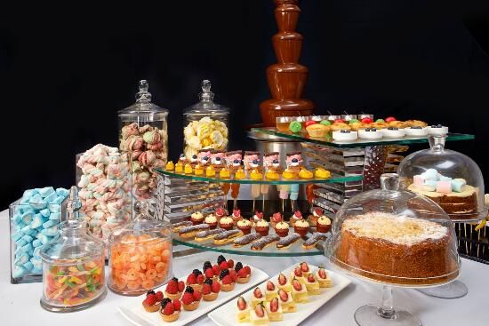 Hi-tea catering setup with pastries and refreshments