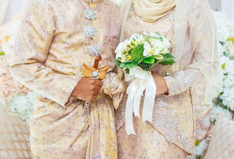 Malay wedding couple at their catered reception