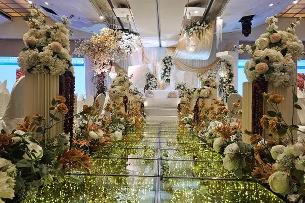 Flower-lined illuminated aisle at Furama City Centre