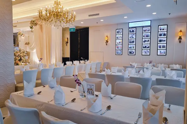 Banquet seating and chandeliers inside The Landmark Ballroom at Bugis