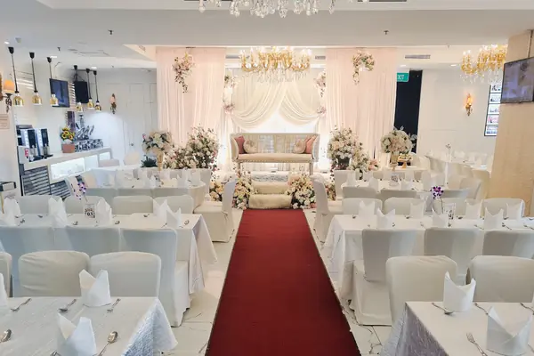 Red carpet wedding aisle inside The Landmark Ballroom at Bugis